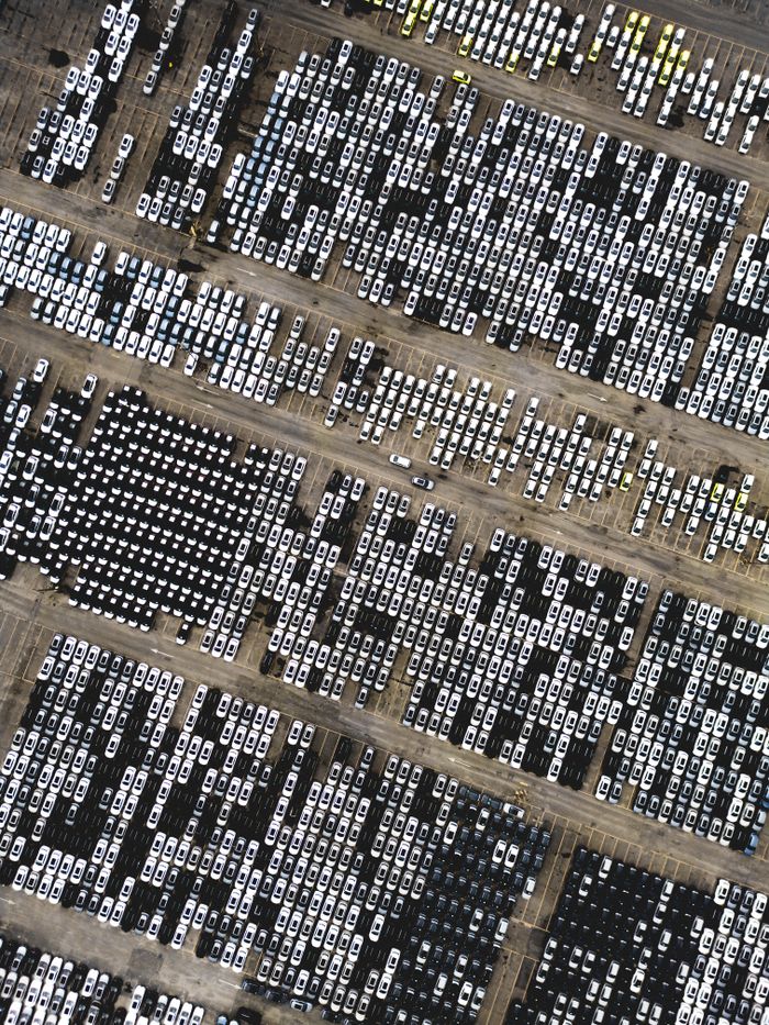 High-angle shot of numerous parked cars in a Brazilian lot.
